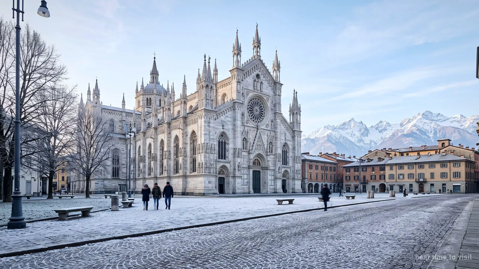 The Duomo di Milano on a crisp winter day, frost on the square and the Alps faint on the horizon