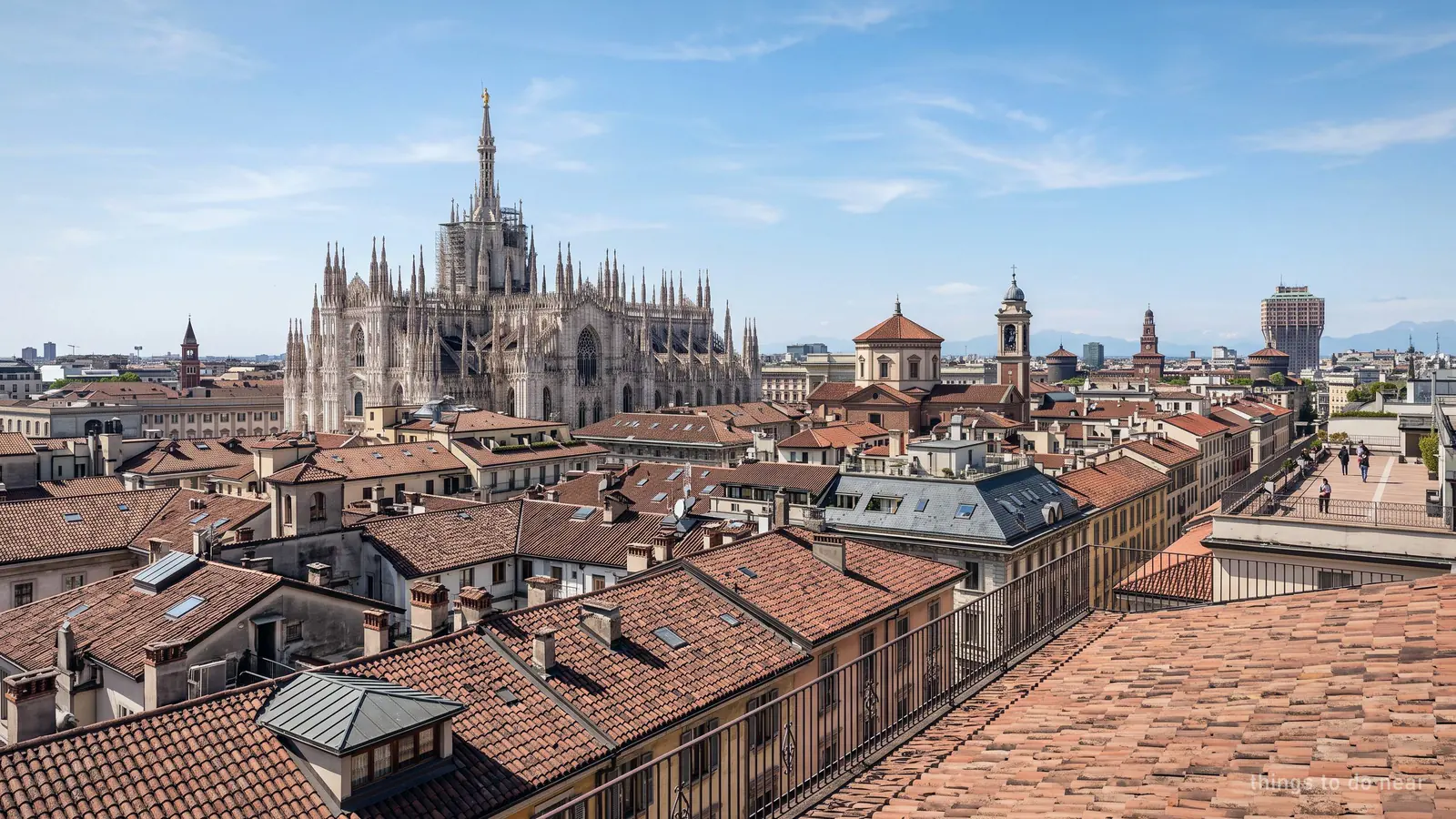 Rooftop view over central Milan with the Duomo rising among the surrounding roofs